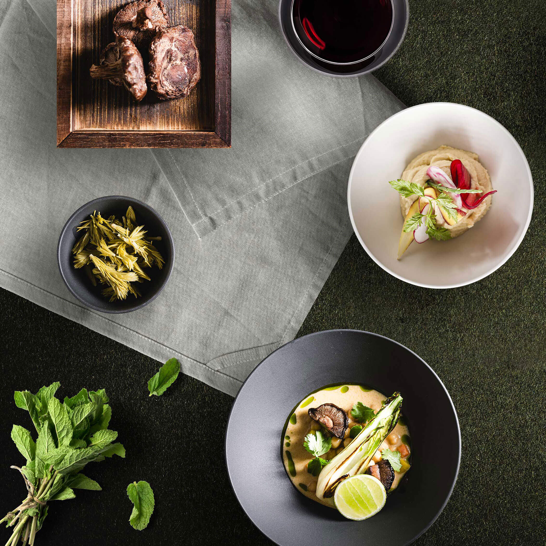 Various dishes on a green background - OLM Nature Escape